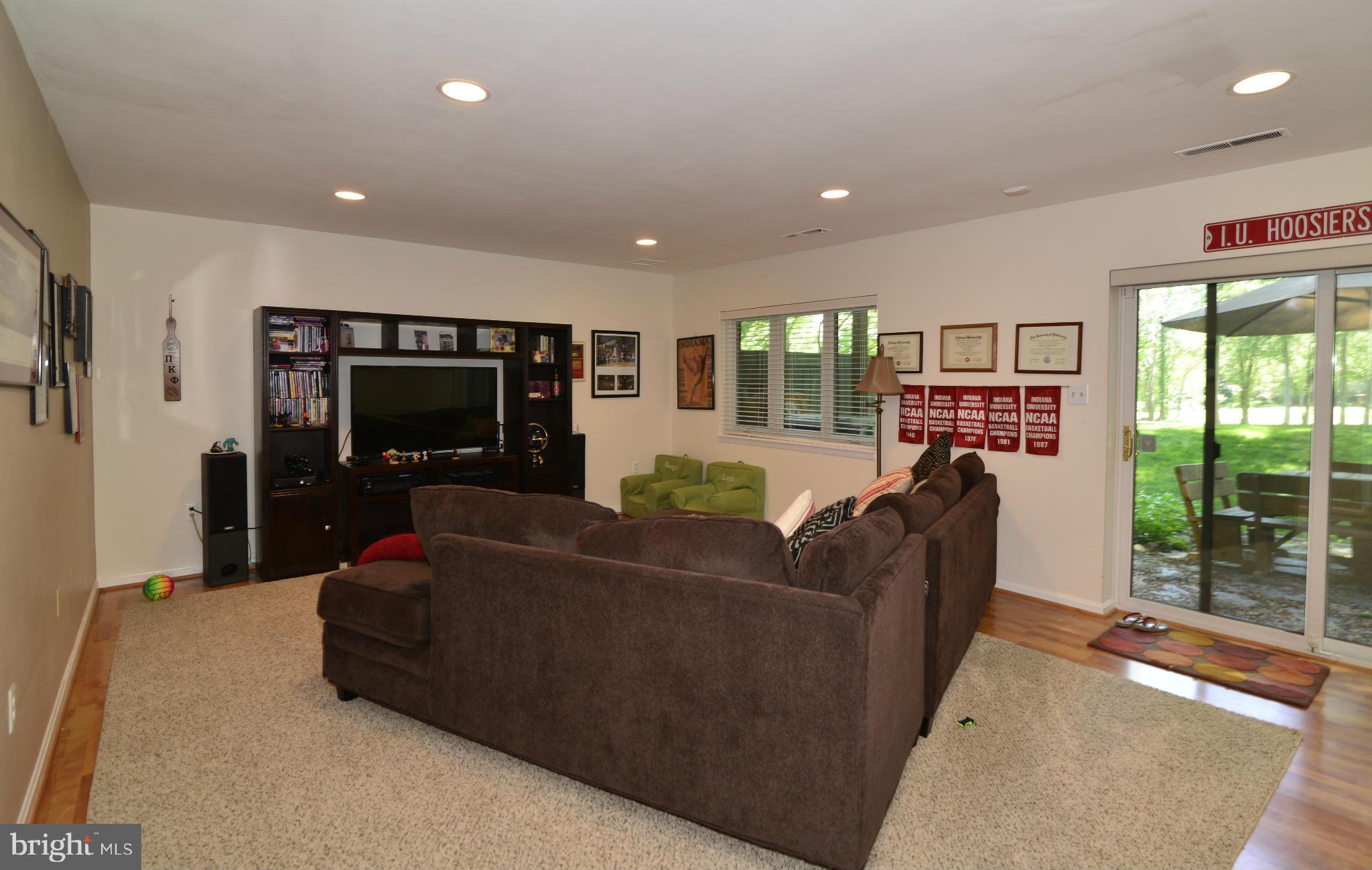 2065 Golf Course Drive Reston, VA 20191 - Photo 26 of 30 a living room with furniture and a flat screen tv