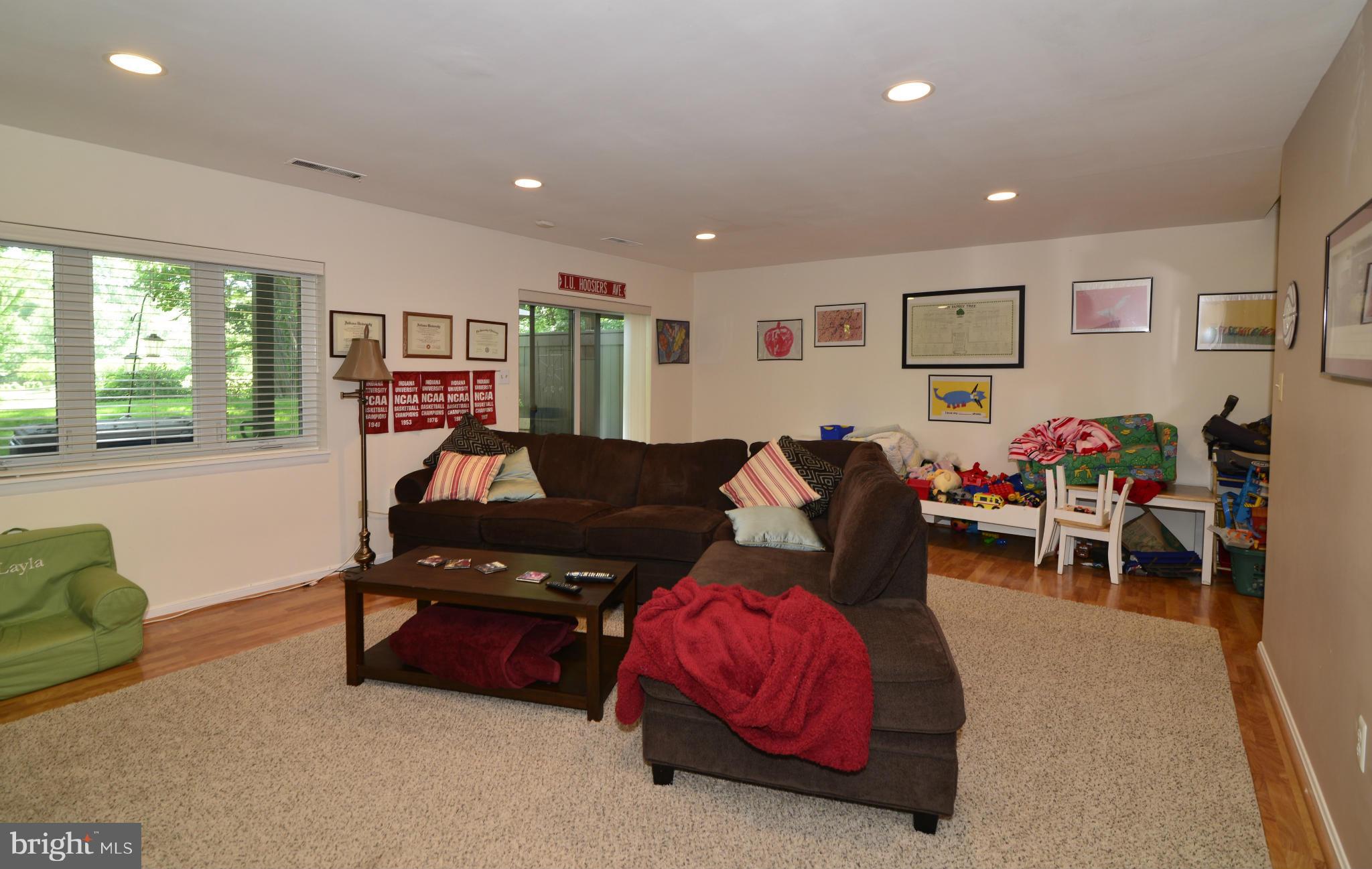 2065 Golf Course Drive Reston, VA 20191 - Photo 27 of 30 a living room with furniture and a flat screen tv