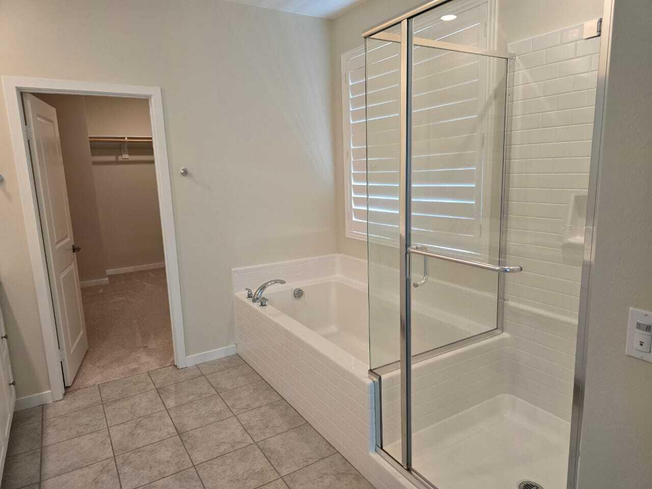 82117 Verdi Road Indio, CA 92203 - Photo 21 of 24 a bathroom with a bathtub and shower