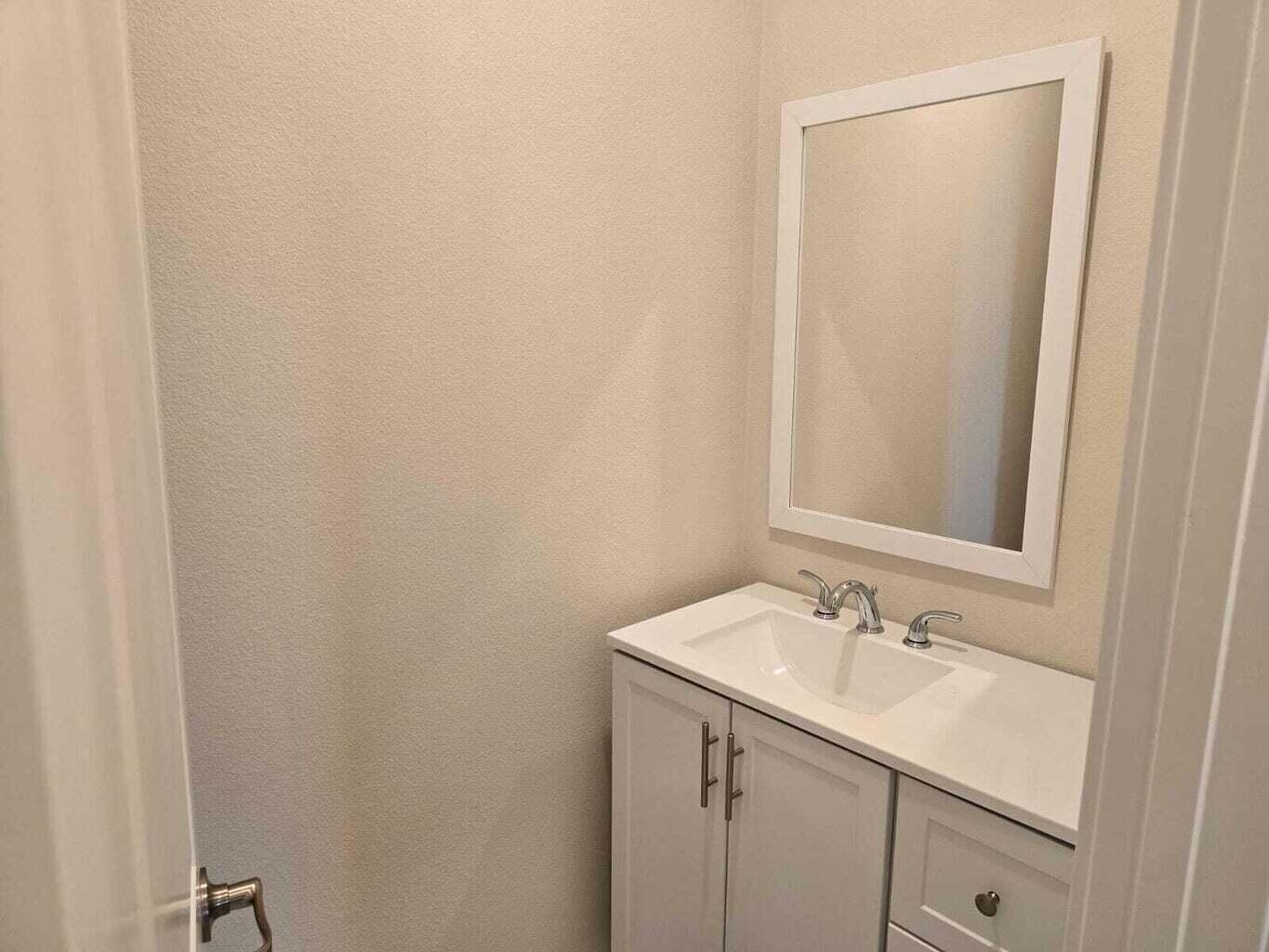 82117 Verdi Road Indio, CA 92203 - Photo 9 of 24 a bathroom with a sink and a mirror