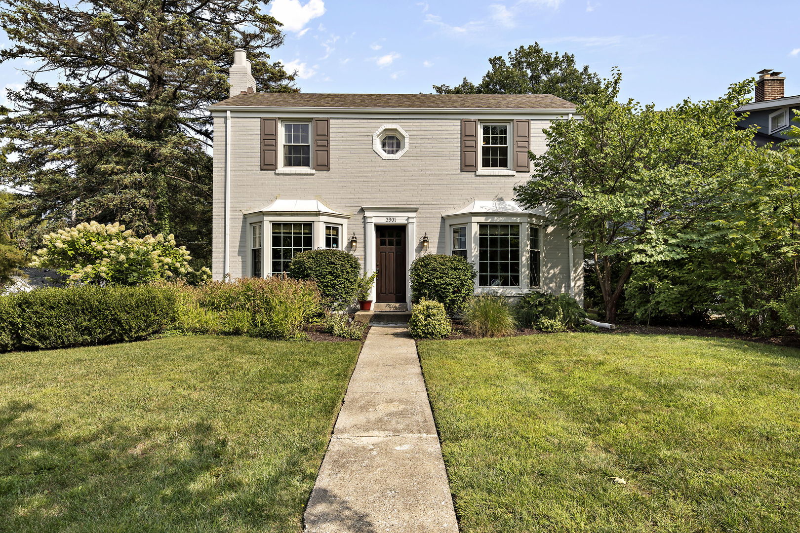 a front view of a house with yard