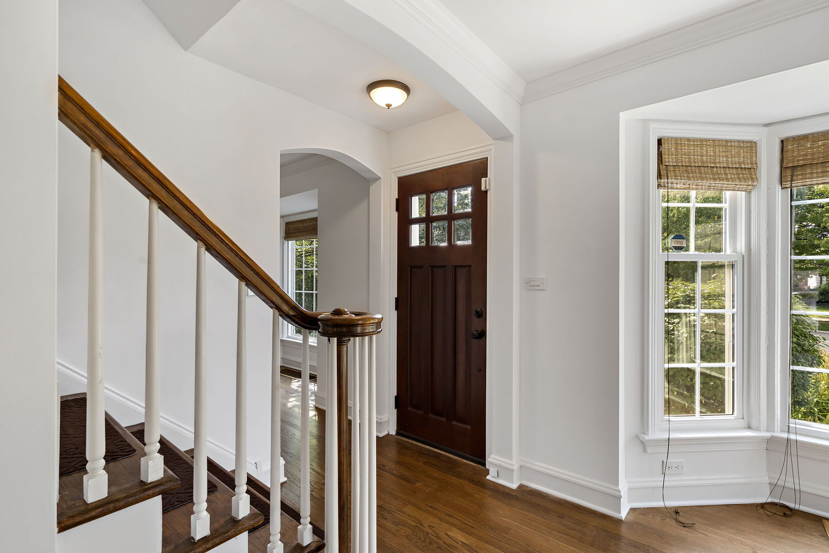 3901 Wolf Road Western Springs, IL 60558 - Photo 3 of 20 a view of an entryway with wooden floor and stairs