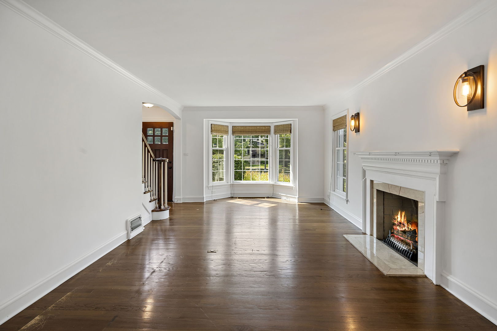 3901 Wolf Road Western Springs, IL 60558 - Photo 8 of 20 a view of an empty room with wooden floor and a window