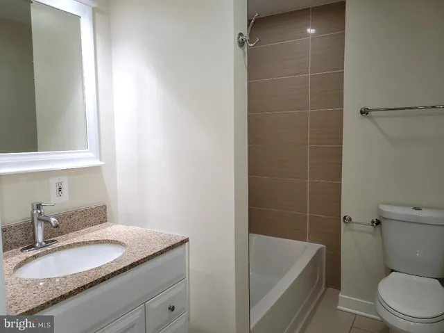 a view of storage and utility room with washer and dryer