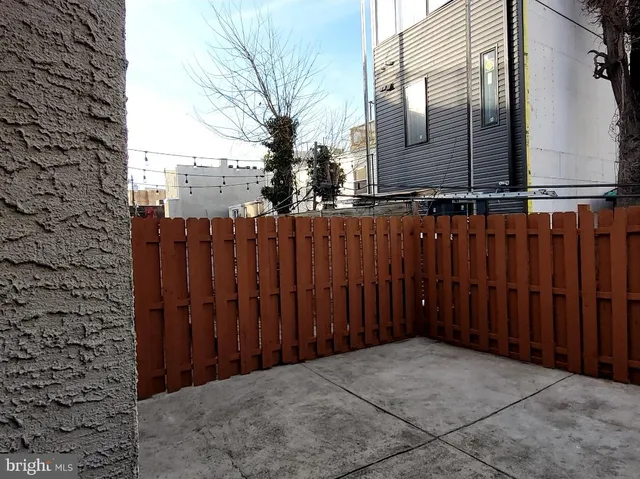 a view of a building with car parked