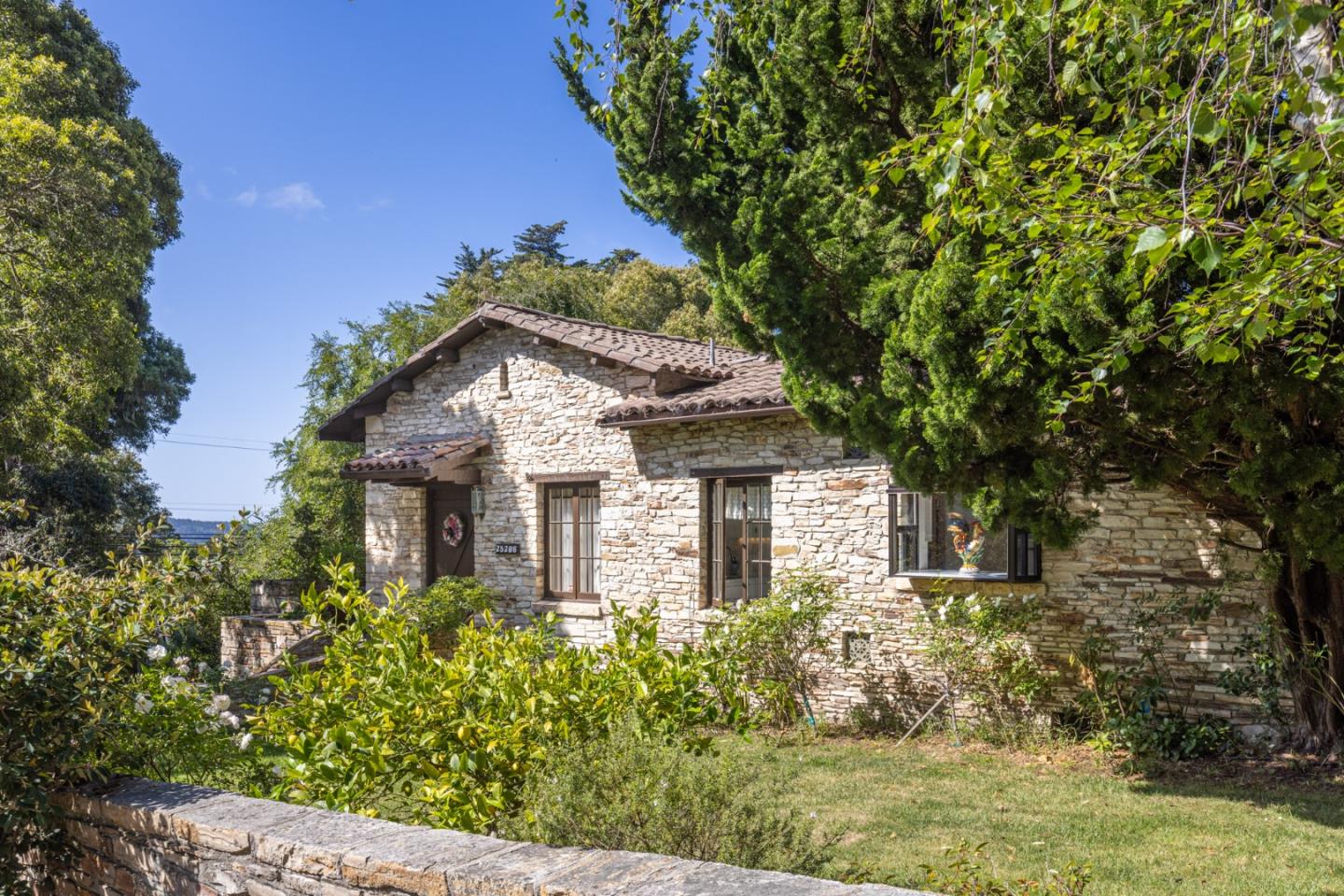 25286 Hatton Road Carmel, CA 93923 - Photo 3 of 34 a house with trees in the background