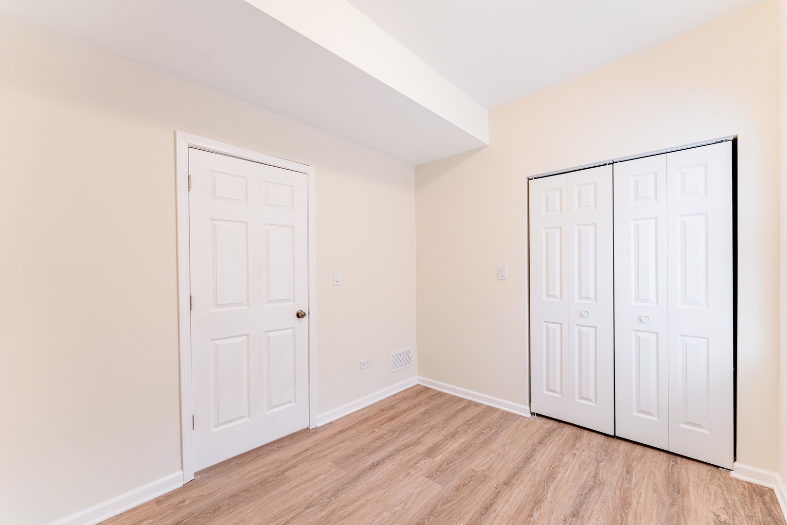 5025 West Huron Street, Unit 2 Chicago, IL 60644 - Photo 12 of 20 a view of an empty room with wooden floor