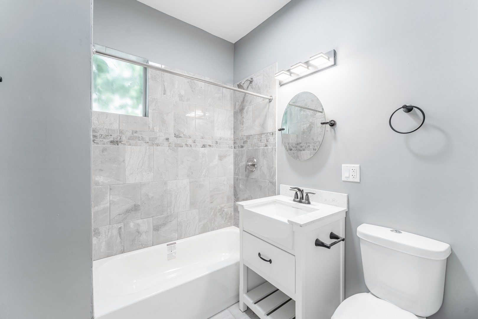 5025 West Huron Street, Unit 2 Chicago, IL 60644 - Photo 13 of 20 a bathroom with a sink toilet and shower