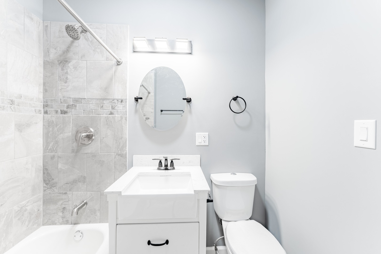 5025 West Huron Street, Unit 2 Chicago, IL 60644 - Photo 14 of 20 a bathroom with a sink toilet and shower