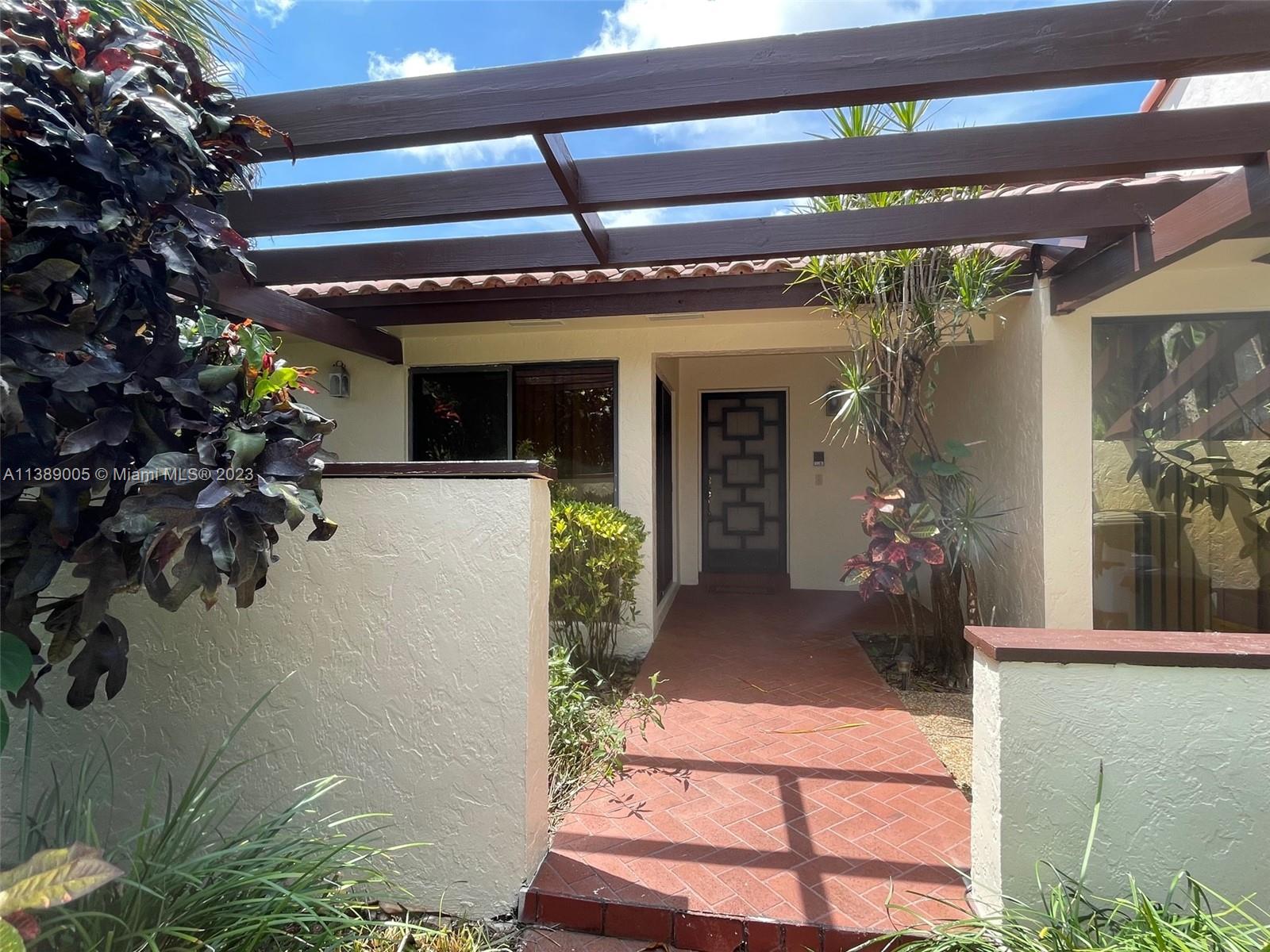 6848 Tiburon Drive Boca Raton, FL 33433 - Photo 1 of 12 front view of a building