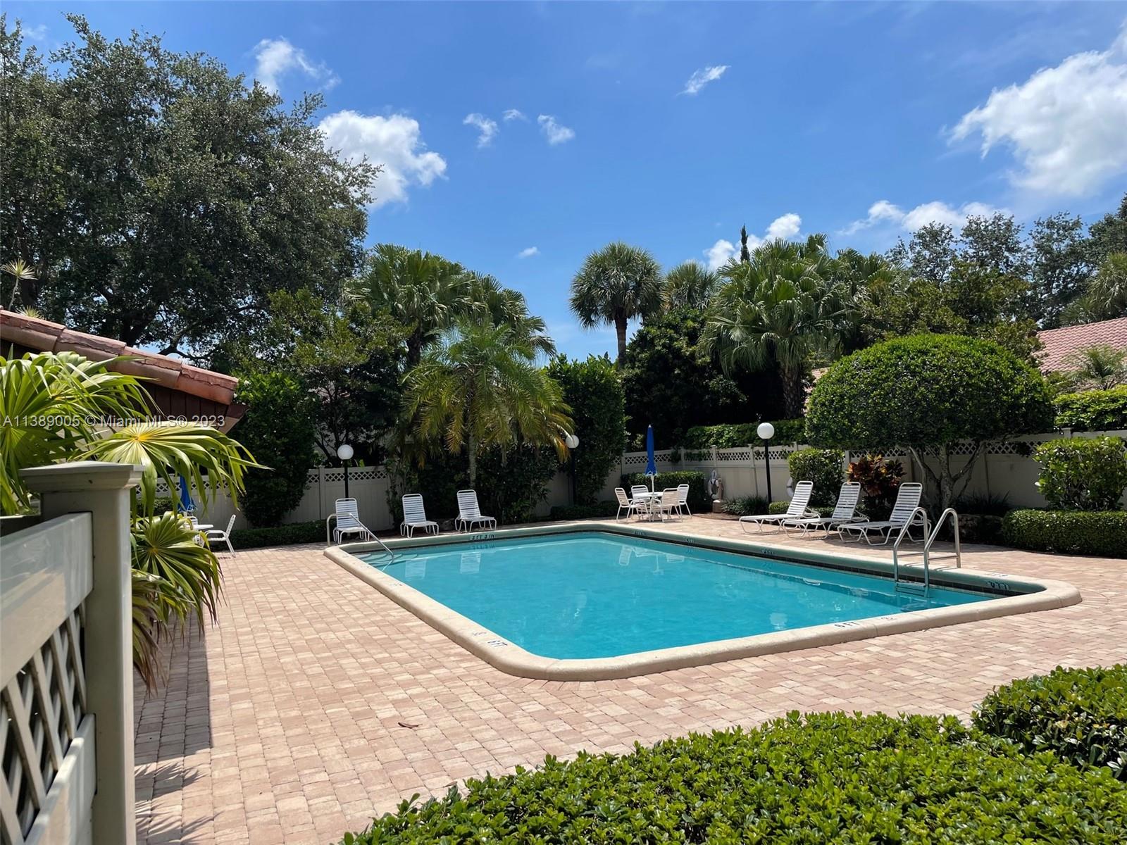 6848 Tiburon Drive Boca Raton, FL 33433 - Photo 12 of 12 a view of a swimming pool with a patio