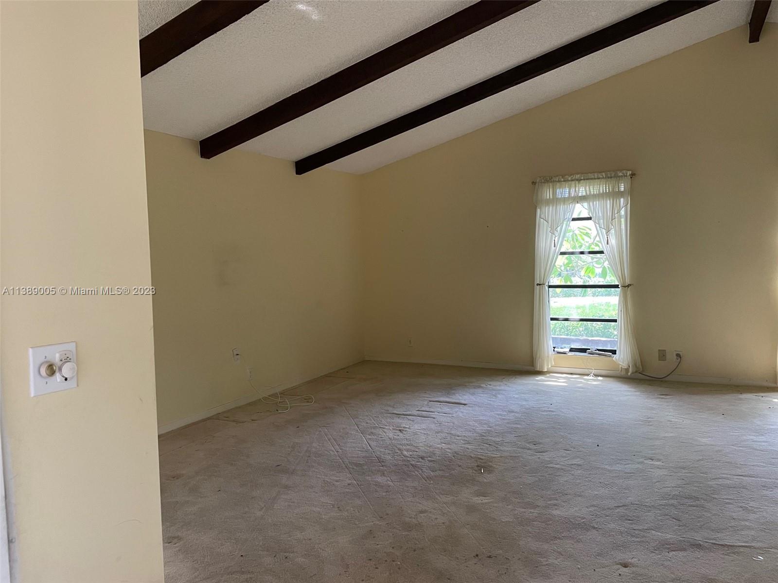 6848 Tiburon Drive Boca Raton, FL 33433 - Photo 2 of 12 a view of empty room with window