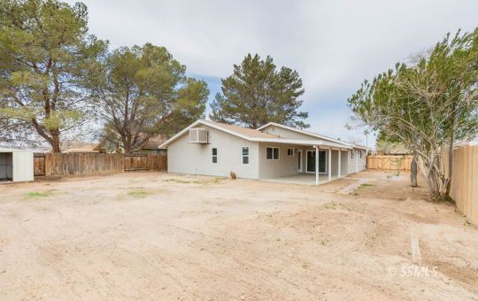 340 South Locust Street Ridgecrest, CA 93555 - Photo 32 of 32 a front view of house with yard and trees