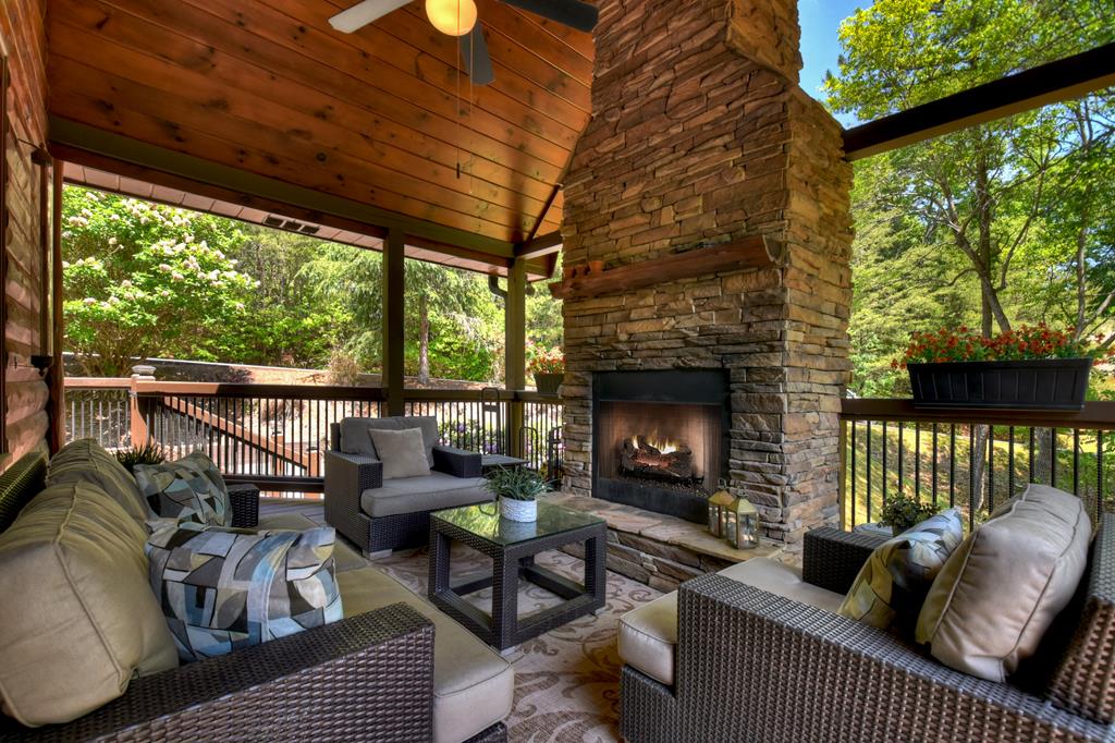 34 Dallas Lane Blue Ridge, GA 30513 - Photo 8 of 56 Covered deck area with wood burning fireplace