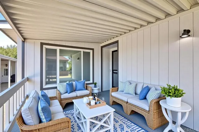 a outdoor living space with furniture and a potted plant