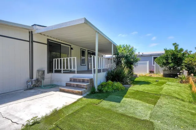 a garden with trees in front of it