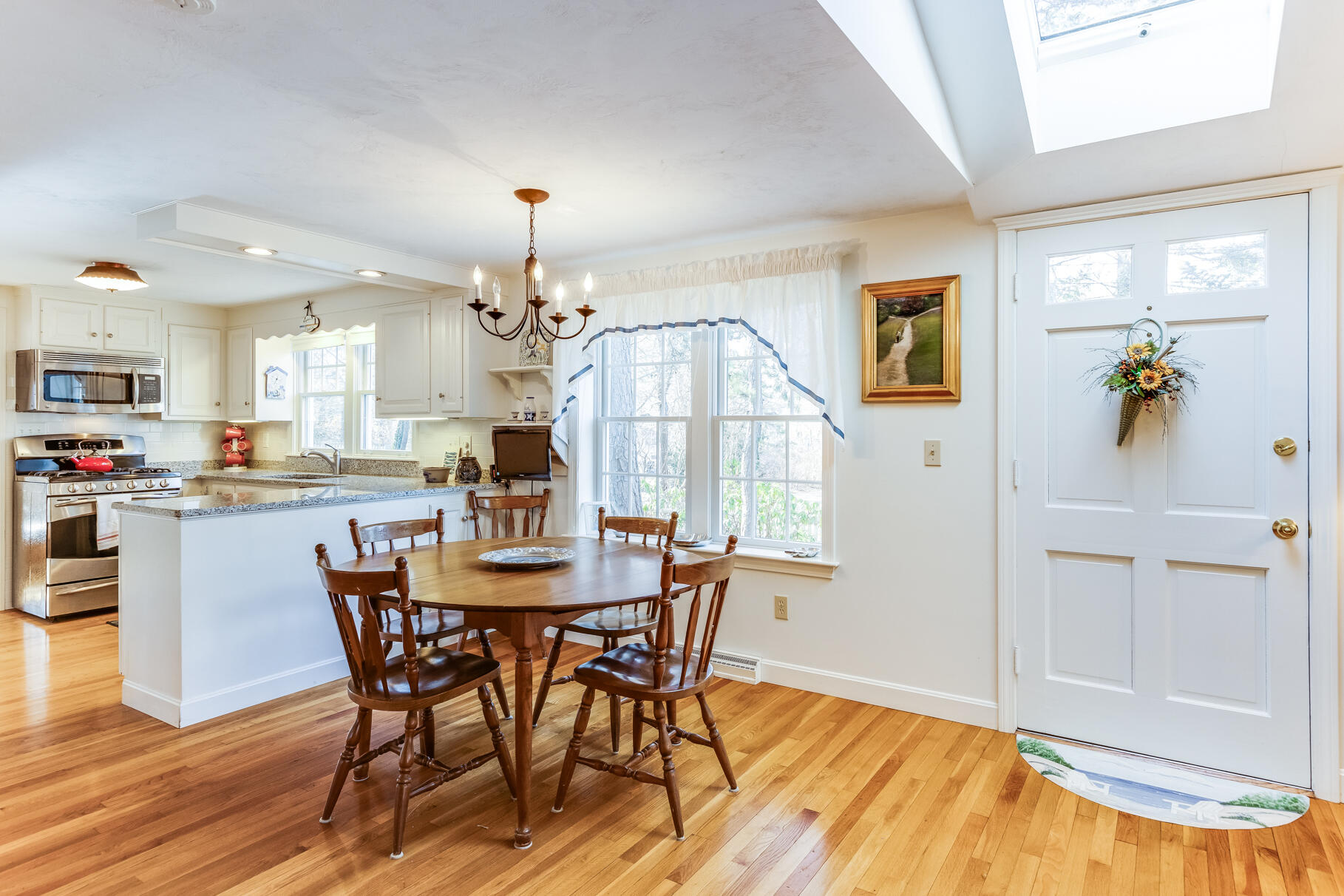 23 Hall Avenue West Harwich, MA 02671 - Photo 15 of 62 a view of a dining room with furniture and wooden floor