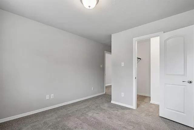 an empty room with closet area