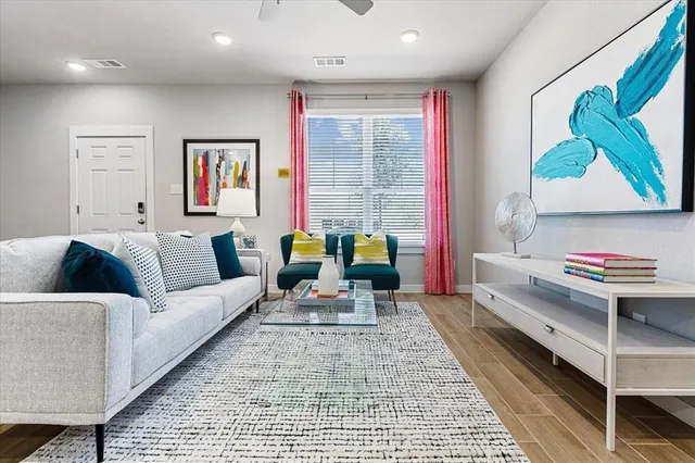 a living room with furniture and a rug