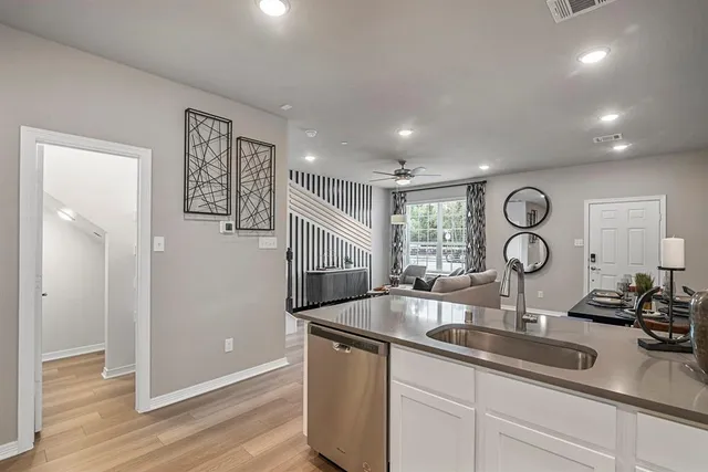 a kitchen with a sink and a refrigerator