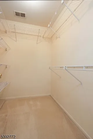 a view of a room with racks on the wall