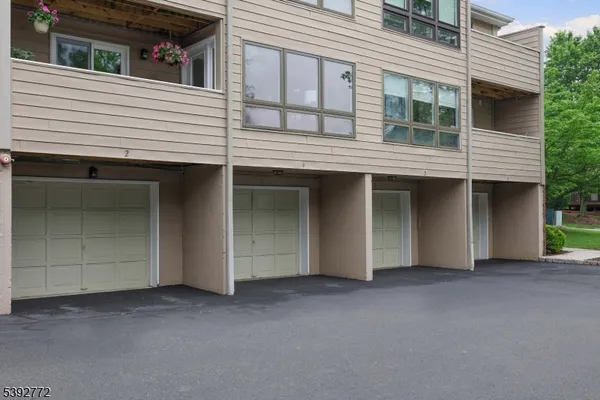 a view of a house with a parking space