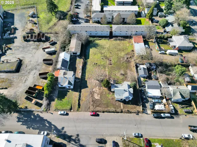 an aerial view of houses with outdoor space
