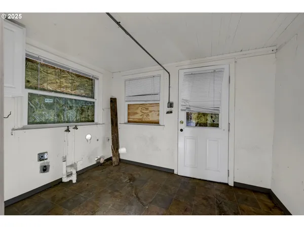 a view of an empty room with a window