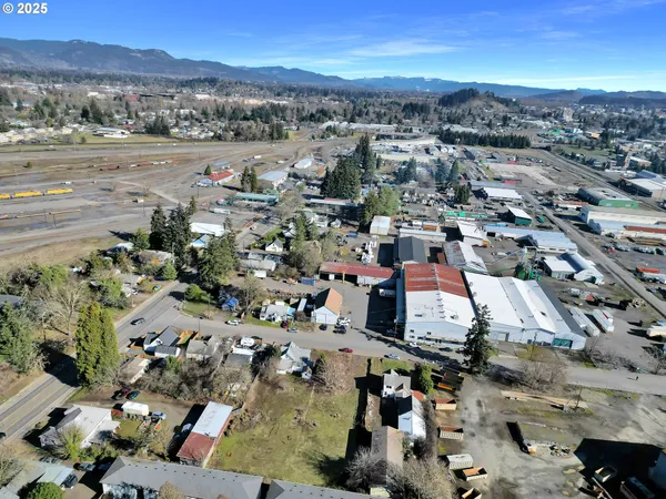an aerial view of a residential houses with outdoor space