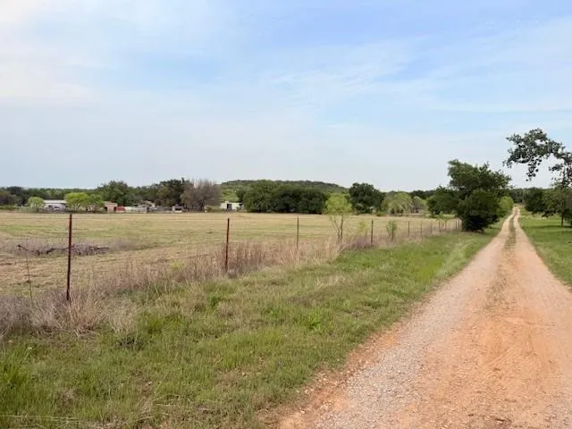 a view of lake with a big yard