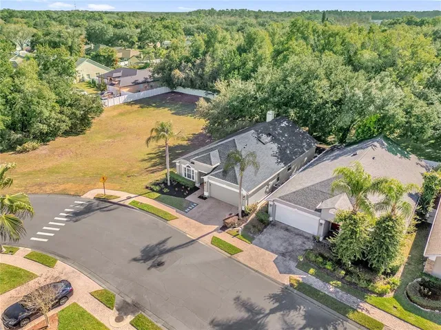an aerial view of a house with a ocean view