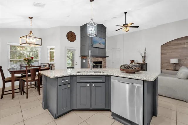 a kitchen with stainless steel appliances granite countertop counter space a sink and cabinets