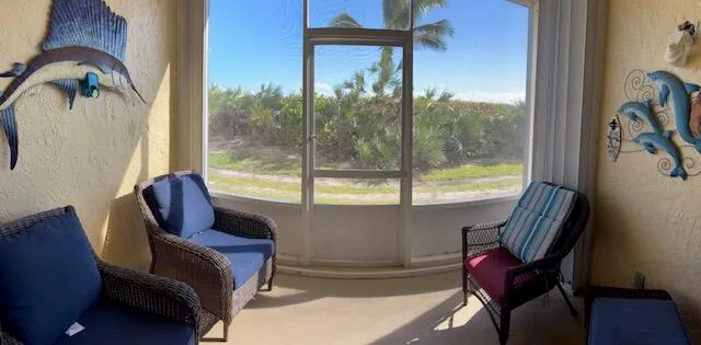 a view of a balcony with chair and table