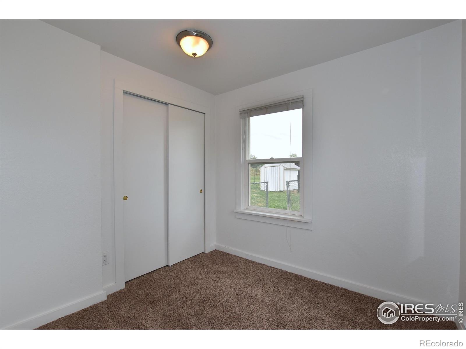 1340 North Taft Hill Road Fort Collins, CO 80521 - Photo 28 of 40 a view of an empty room with a window