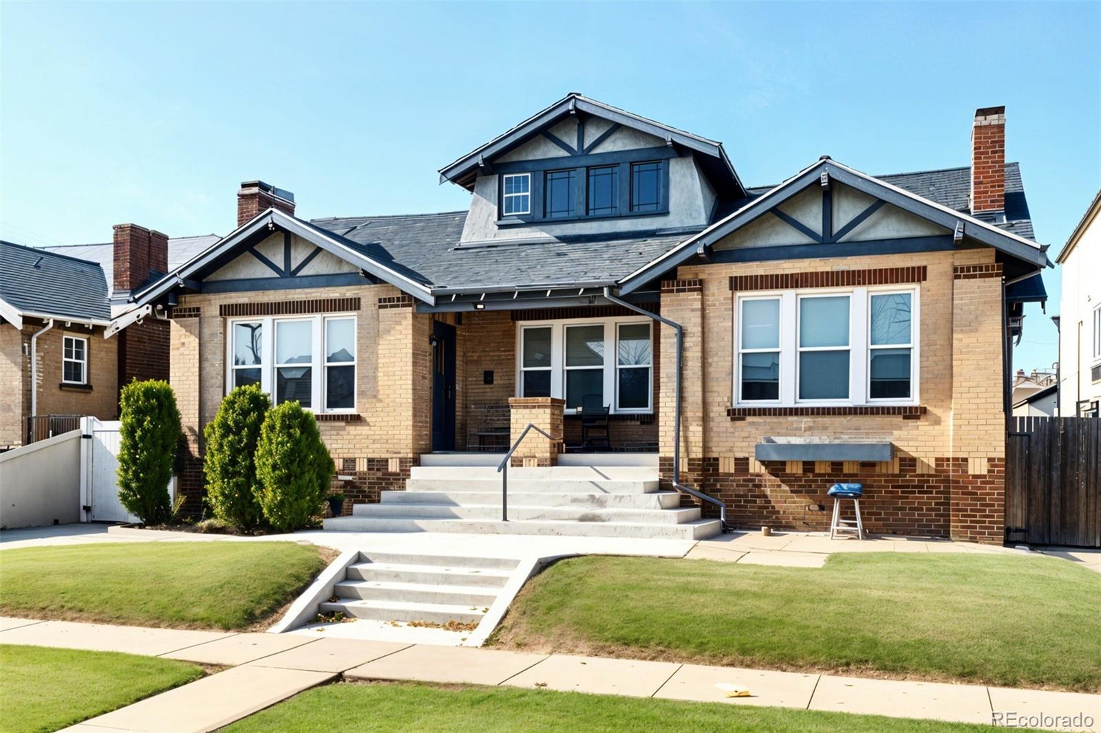 1411-1419 Meade Street Denver, CO 80204 - Photo 1 of 20 a front view of a house with a yard
