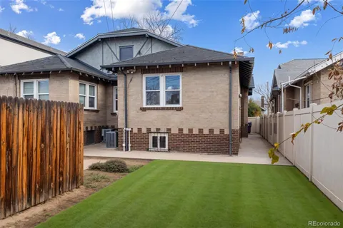 a front view of house with yard outdoor seating and barbeque oven