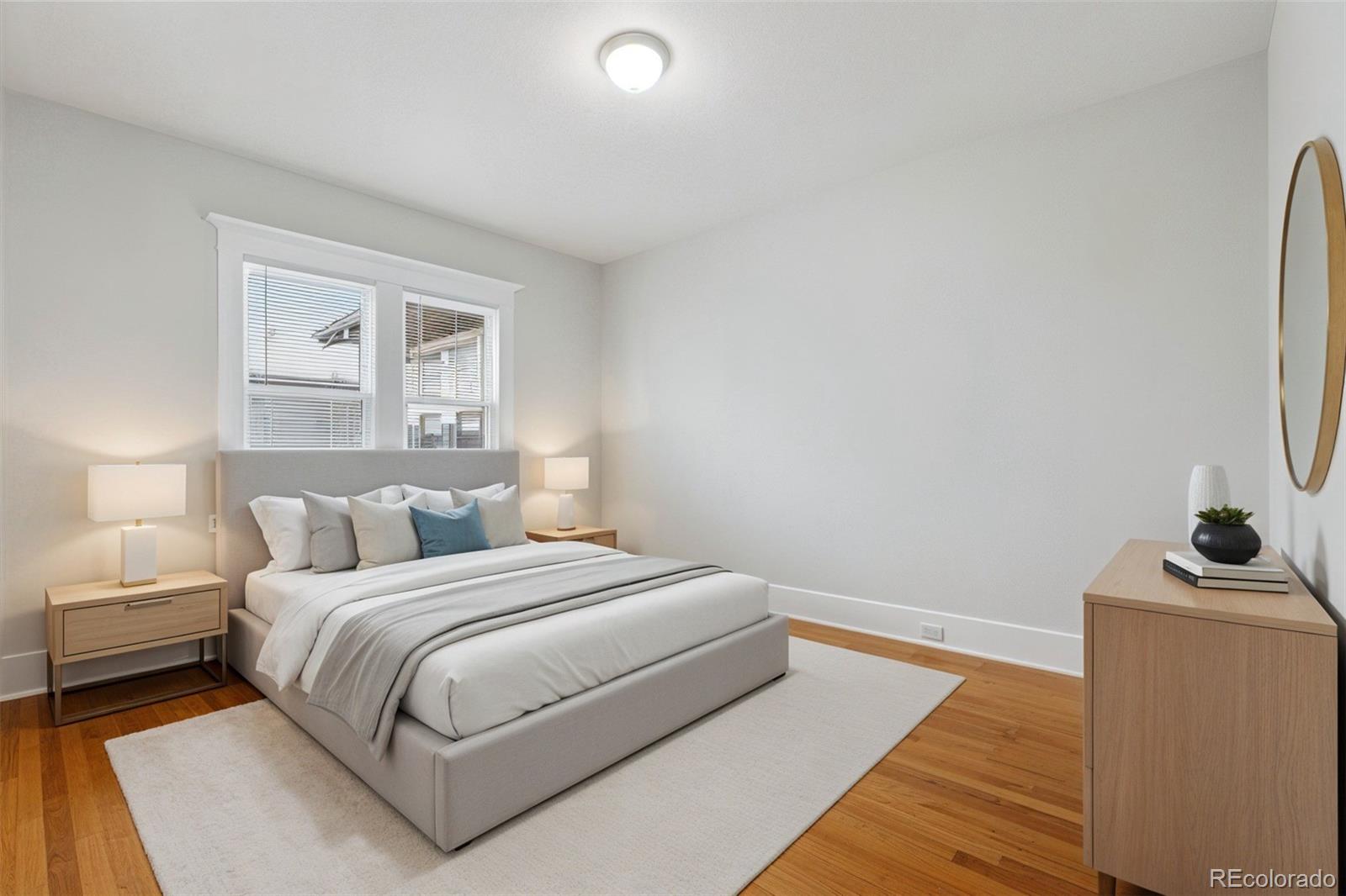 1411-1419 Meade Street Denver, CO 80204 - Photo 10 of 20 a bedroom with a bed and a desk