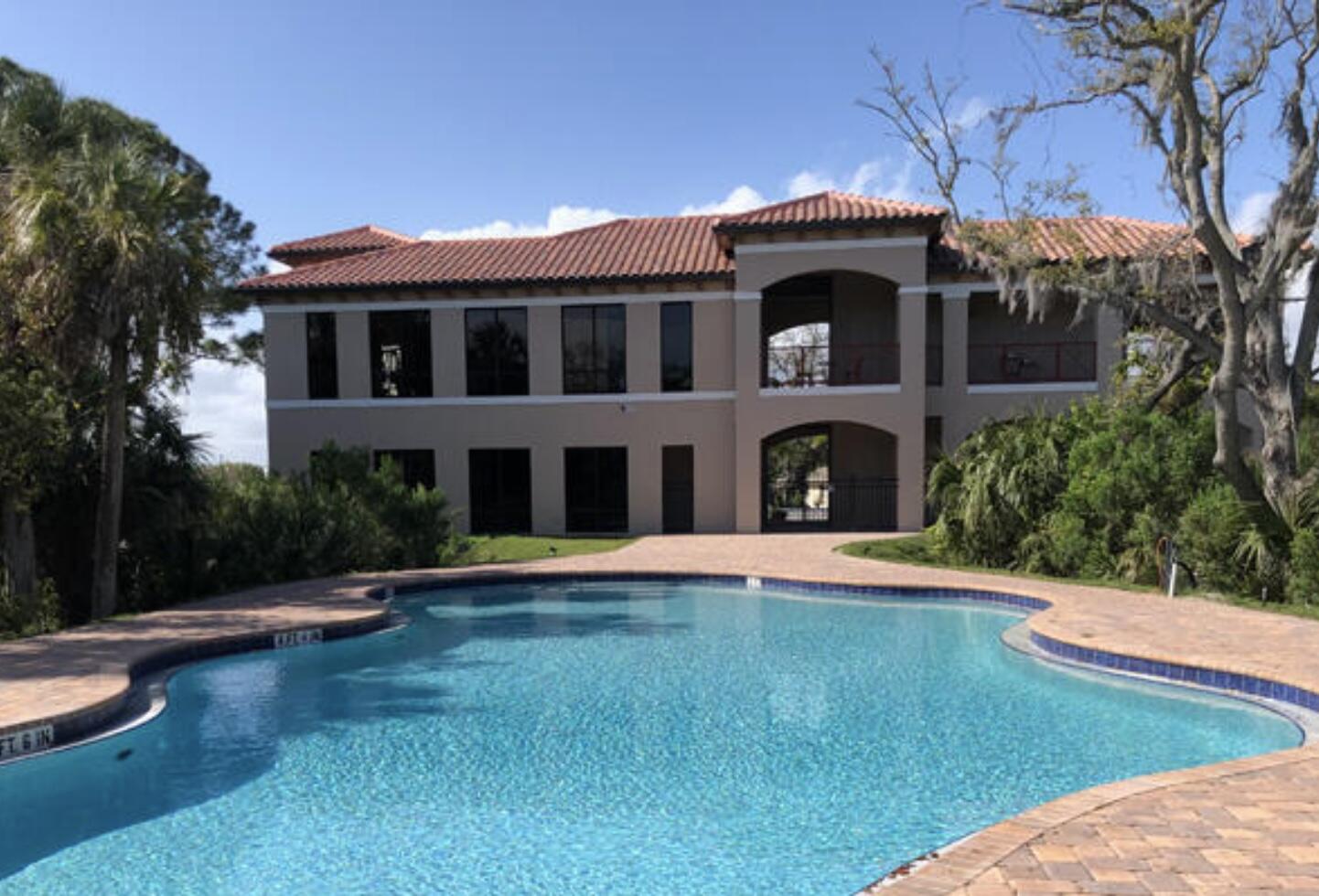 735 Pilot Lane, Unit 314 Merritt Island, FL 32952 - Photo 18 of 41 a front view of a house with yard