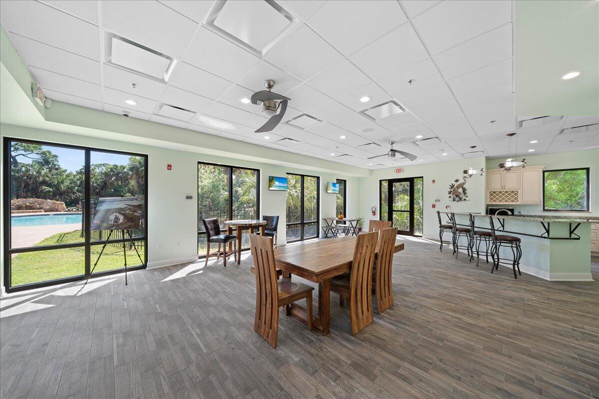 735 Pilot Lane, Unit 314 Merritt Island, FL 32952 - Photo 20 of 41 a dining room with furniture window and wooden floor