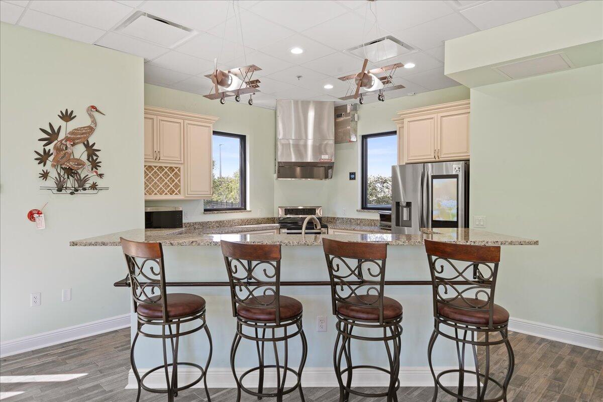 735 Pilot Lane, Unit 314 Merritt Island, FL 32952 - Photo 21 of 41 a view of a dining room with furniture and a chandelier