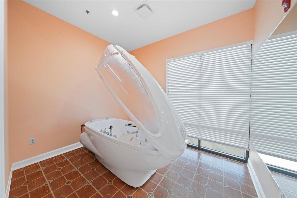 735 Pilot Lane, Unit 314 Merritt Island, FL 32952 - Photo 27 of 41 a bathroom with a bathtub and shower