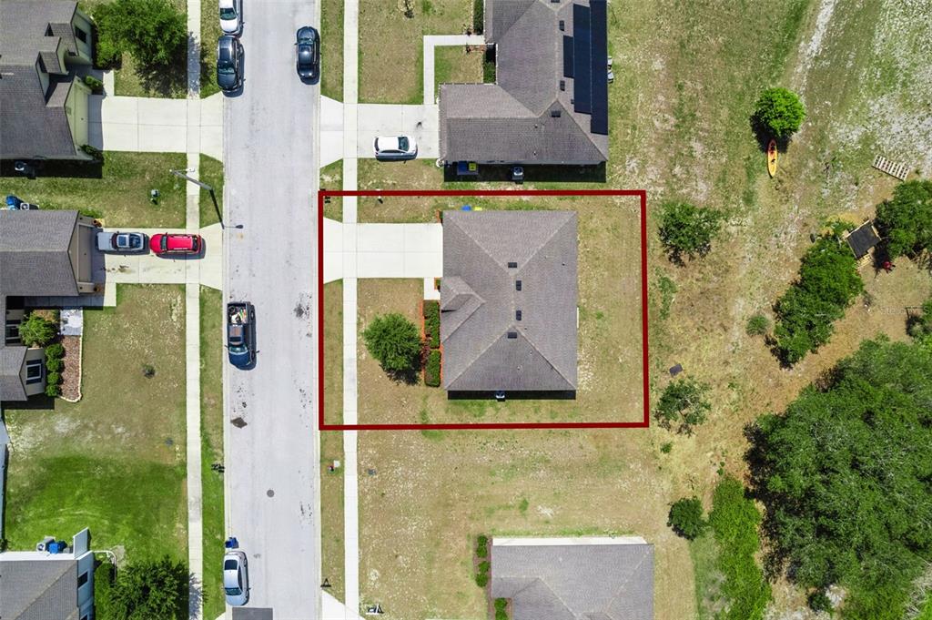 1613 Orne Street Mascotte, FL 34753 - Photo 29 of 31 aerial view of multi story residential apartment building with yard