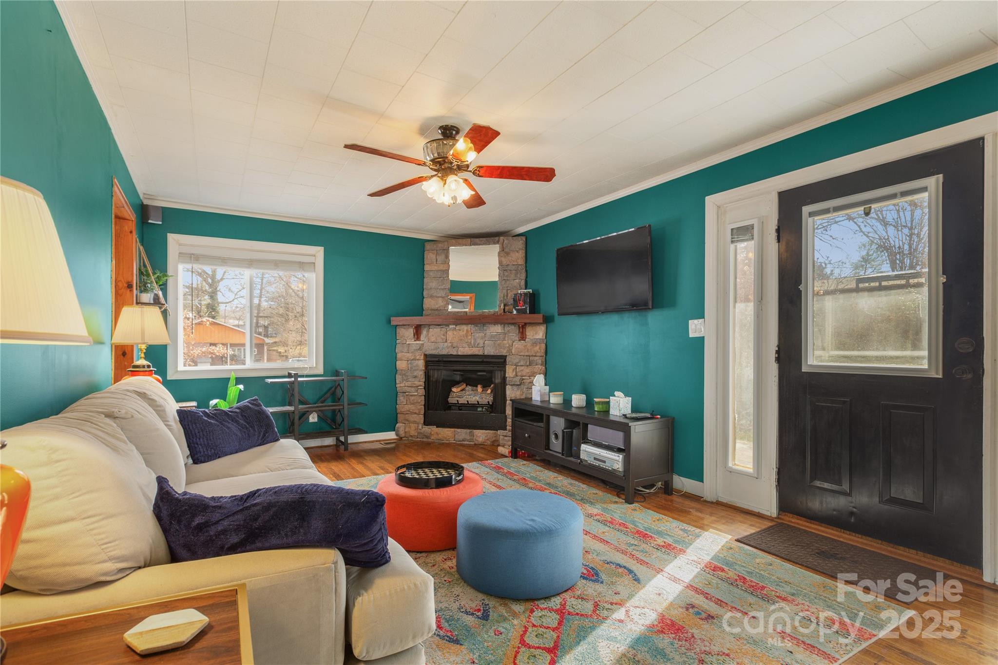 333 Oakview Park Road Asheville, NC 28803 - Photo 1 of 31 a living room with furniture a window and a fireplace