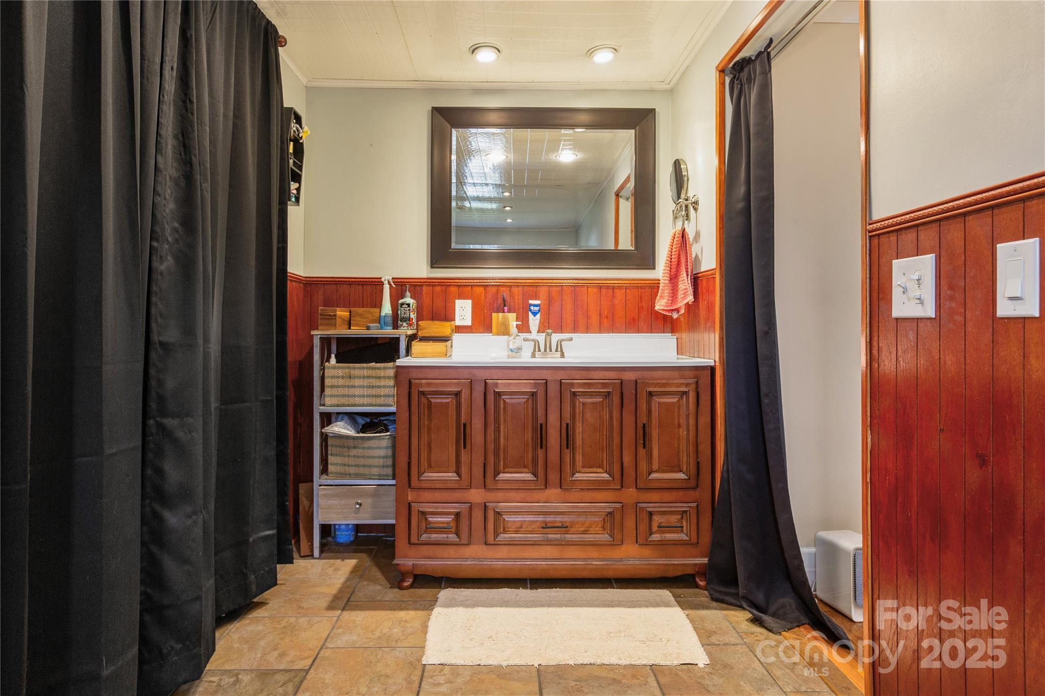 333 Oakview Park Road Asheville, NC 28803 - Photo 14 of 31 a bathroom with a sink a mirror and a vanity