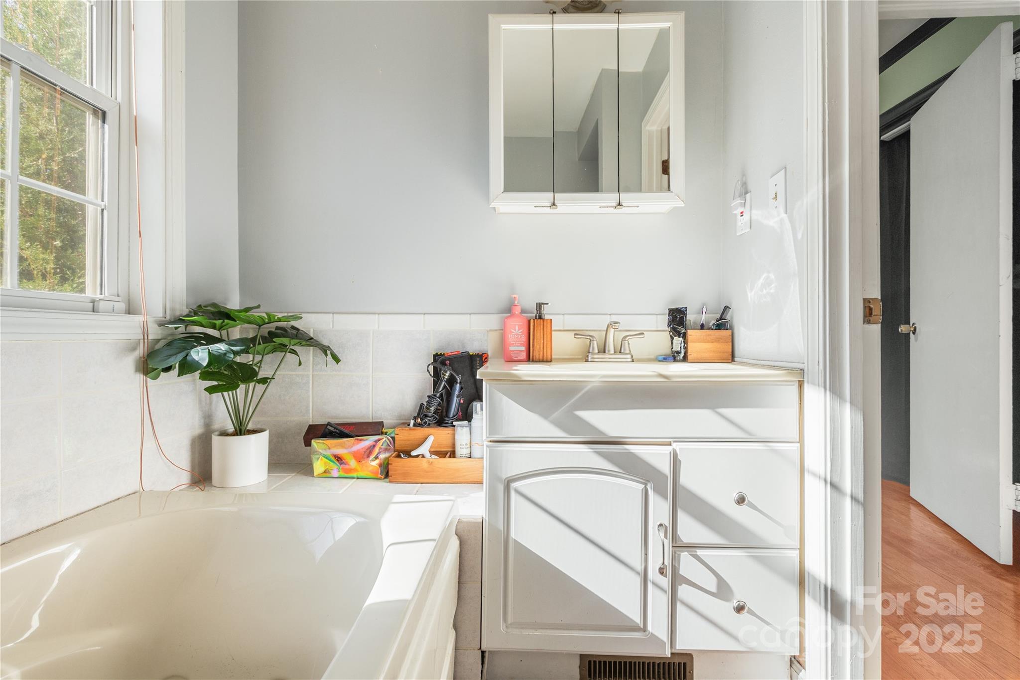 333 Oakview Park Road Asheville, NC 28803 - Photo 18 of 31 a room with a sink and a mirror