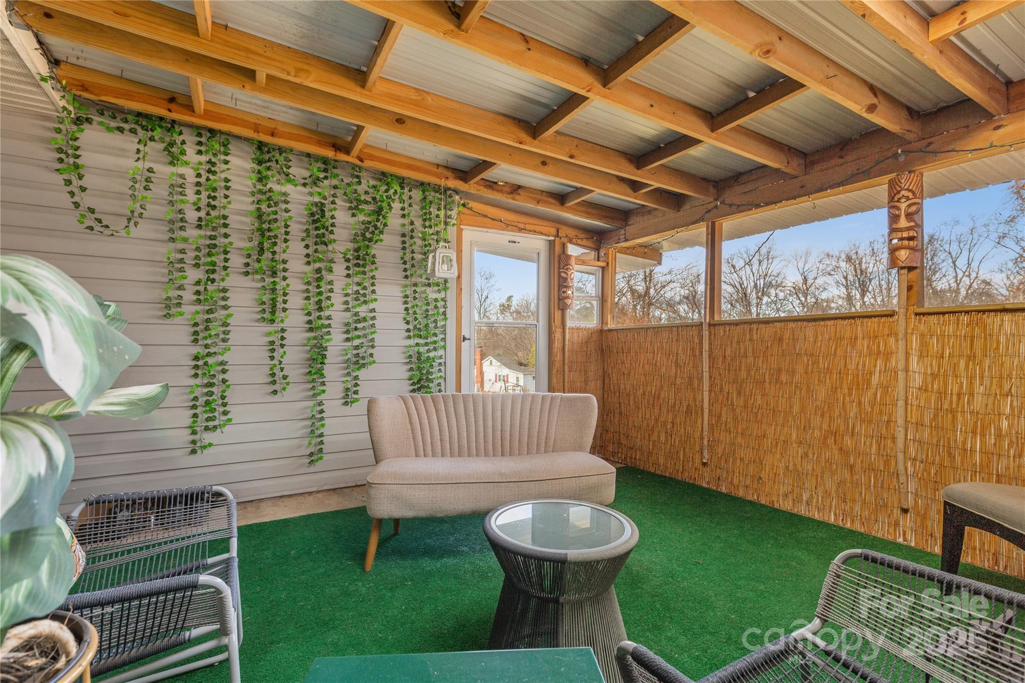 333 Oakview Park Road Asheville, NC 28803 - Photo 20 of 31 a view of a porch with furniture and a yard