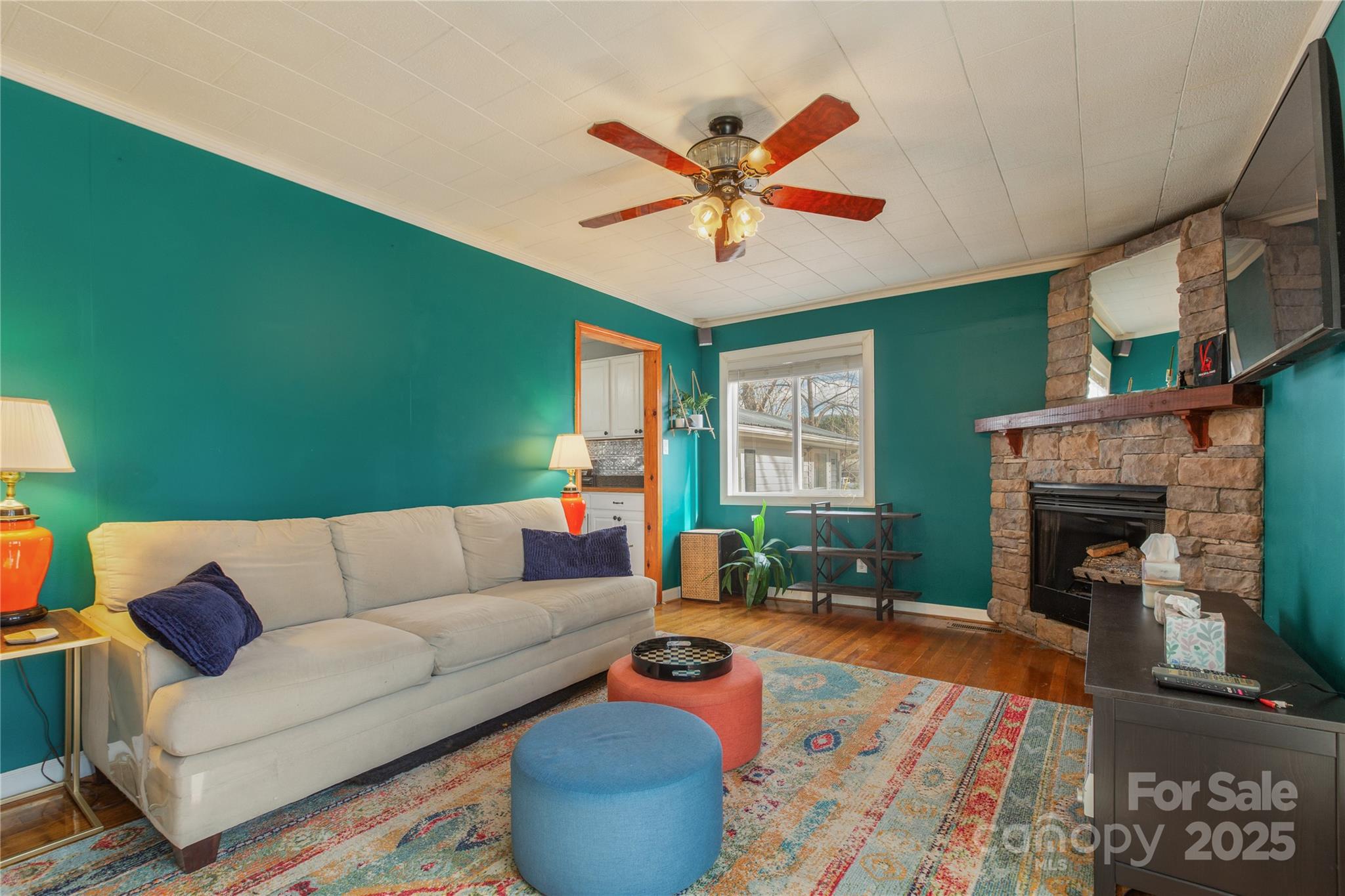 333 Oakview Park Road Asheville, NC 28803 - Photo 2 of 31 a living room with furniture and a fireplace