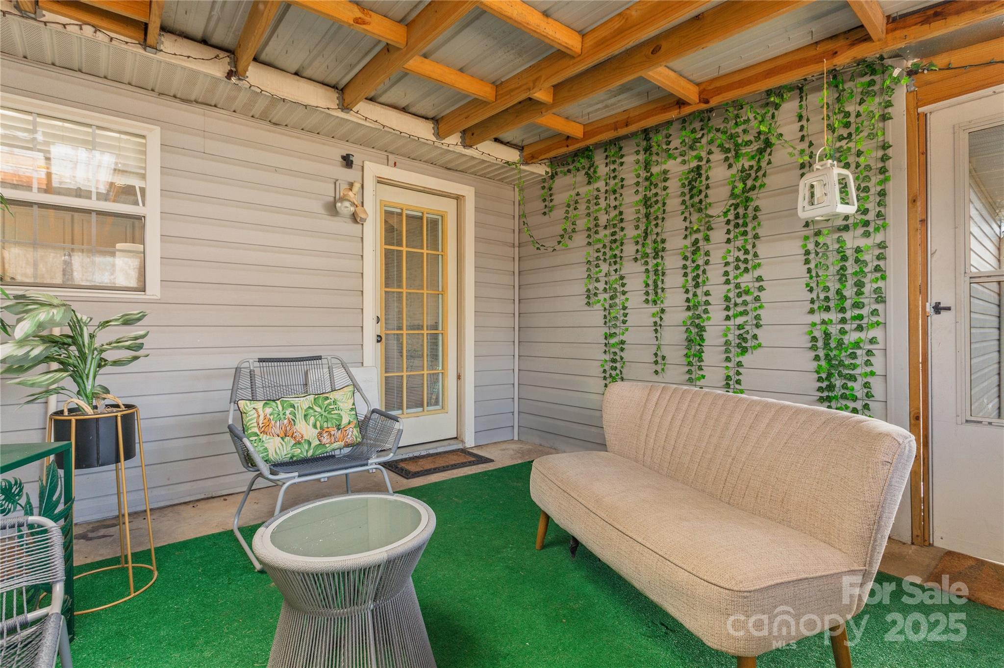333 Oakview Park Road Asheville, NC 28803 - Photo 21 of 31 a balcony with furniture and a potted plant