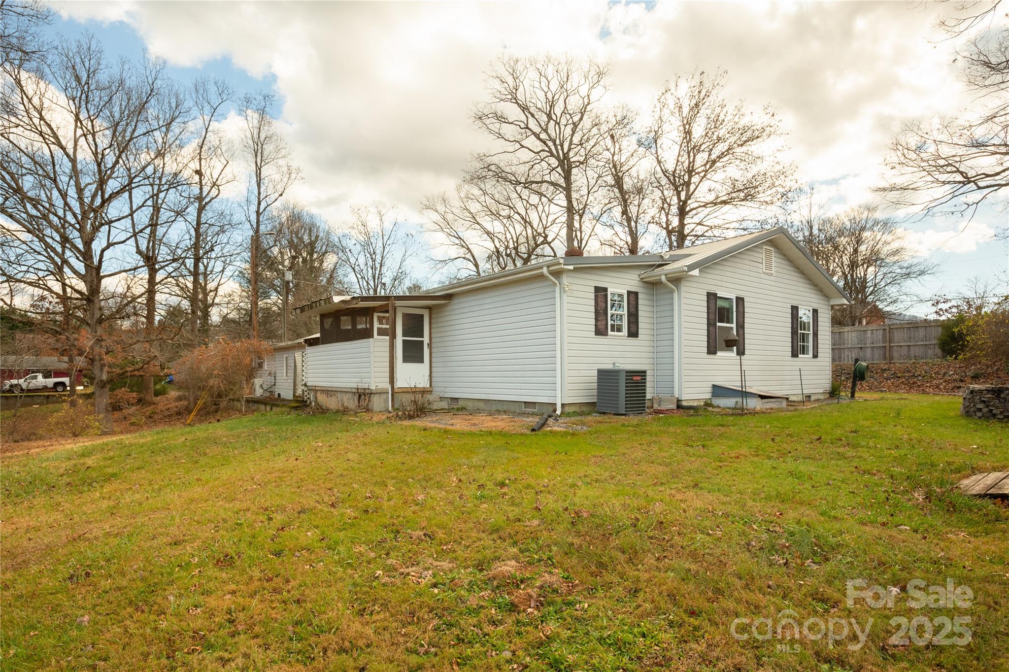333 Oakview Park Road Asheville, NC 28803 - Photo 27 of 31 a view of a house with a yard and garage