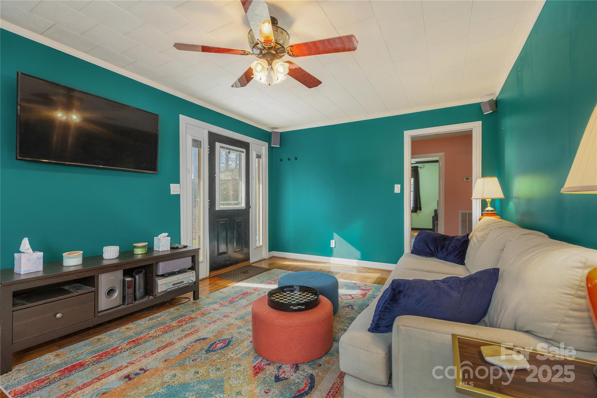 333 Oakview Park Road Asheville, NC 28803 - Photo 3 of 31 a living room with furniture and a flat screen tv